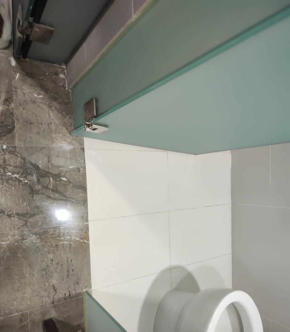 Polished marble bathroom floor beside the toilet