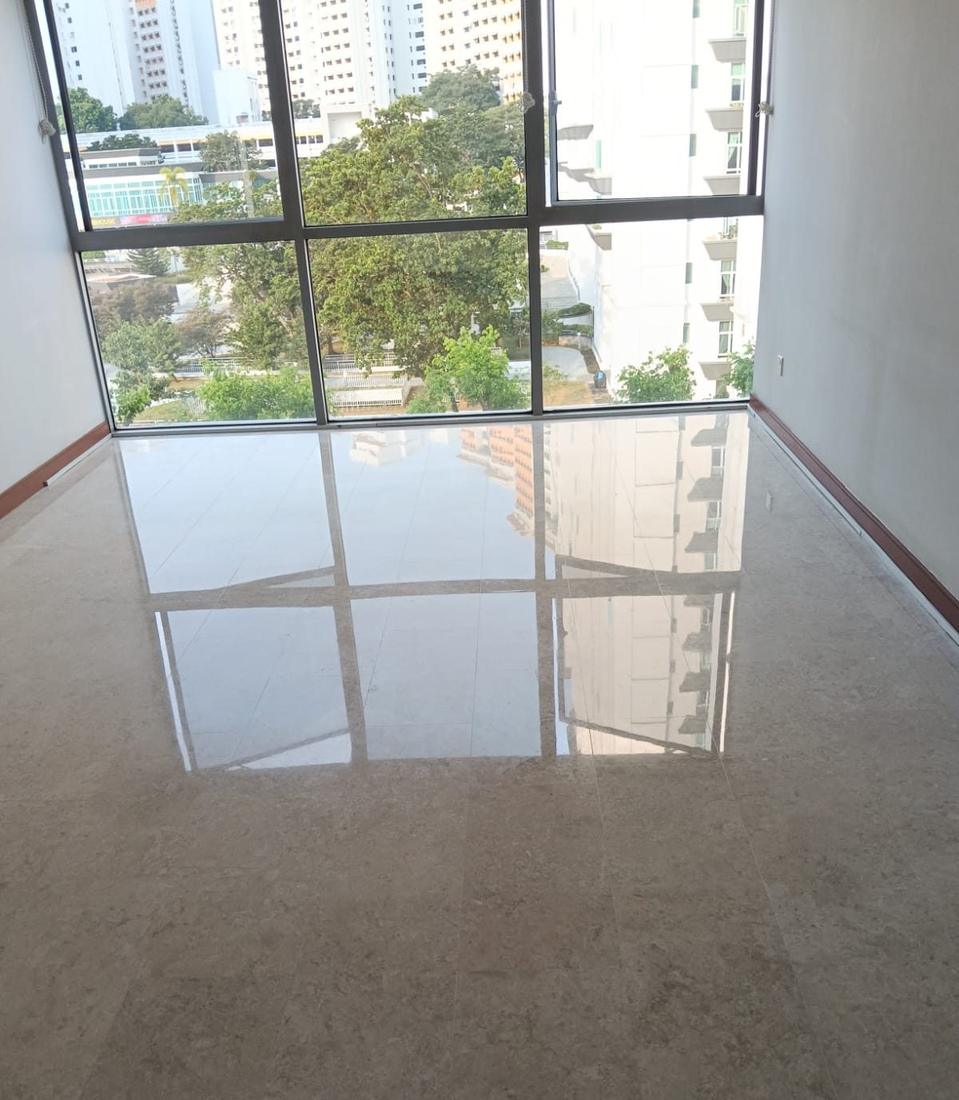Marble floor with a mirror shine reflecting a large window